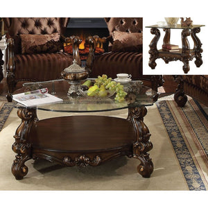  Coffee Table w/Curved Glass Top â€¢ Open Compartment: Bottom Shelf â€¢ 10mm Clear Tempered Glass w/Beveled â€¢ Oversized Scrolled Legs & Shelf Apron: Poly Resin with Antique Contrast Finish<br/><br/><b>Product Features</b><ul><li>Coffee Table w/Curved