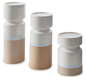 Exuding a sense of earthy elegance, this candle holder set is one tantalizing trio. With their varying heights, these candle holders permeate just the right ambiance when displayed individually or in a group. They-'re finished with a reactive glazeâ€”a te