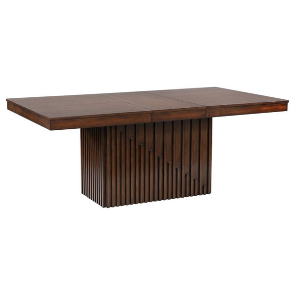 Robust design and superb styling pair beautifully in a modern wooden dining table. It includes an extension leaf ideal for everyday or occasional use, creating a larger table perfect for guests. The table is crafted with Asian hardwoods and receives a man