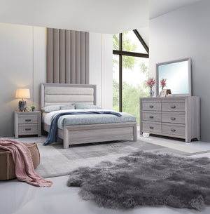 This bedroom set is the embodiment of understated sophistication, featuring a neutral drift wood finish that complements its clean and contemporary design. The robust bed frame anchors the room with a plush channel tufted headboard. Accompanying the bed a