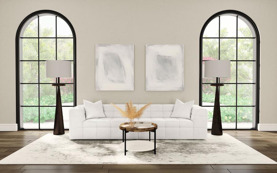 Introduce a touch of playful sophistication to your living space with this extra long 114-inch sofa. Designed for those who appreciate both style and comfort, this extra long sofa features fun geometric details, a detailed grid tufted design, and soft tex