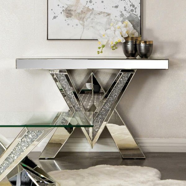  featuring inlays of sparkling acrylic crystals. The geometric form is complemented by sleek mirrored surfaces that enhance its modern aesthetic. The design combines 
