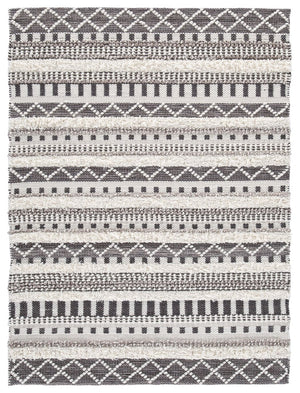 Stay on trend with tribal chic. This area rug is just neutral enough to work with your decor and just cool enough to keep your space hip. Decorate again and again on top of this dynamic floor covering