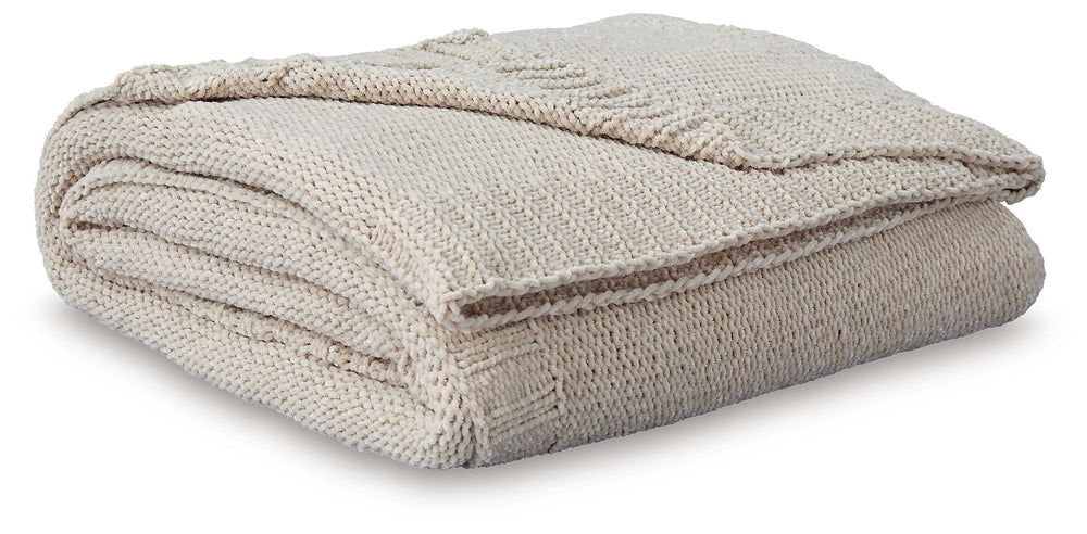 Comfort meets casually chic style in this throw blanket. Its neutral hue and knitted construction create trendy textural variation when draped over a sofa or the foot of a bed. And it goes beyond style, with the soft chenille fabric acting as a cozy compa