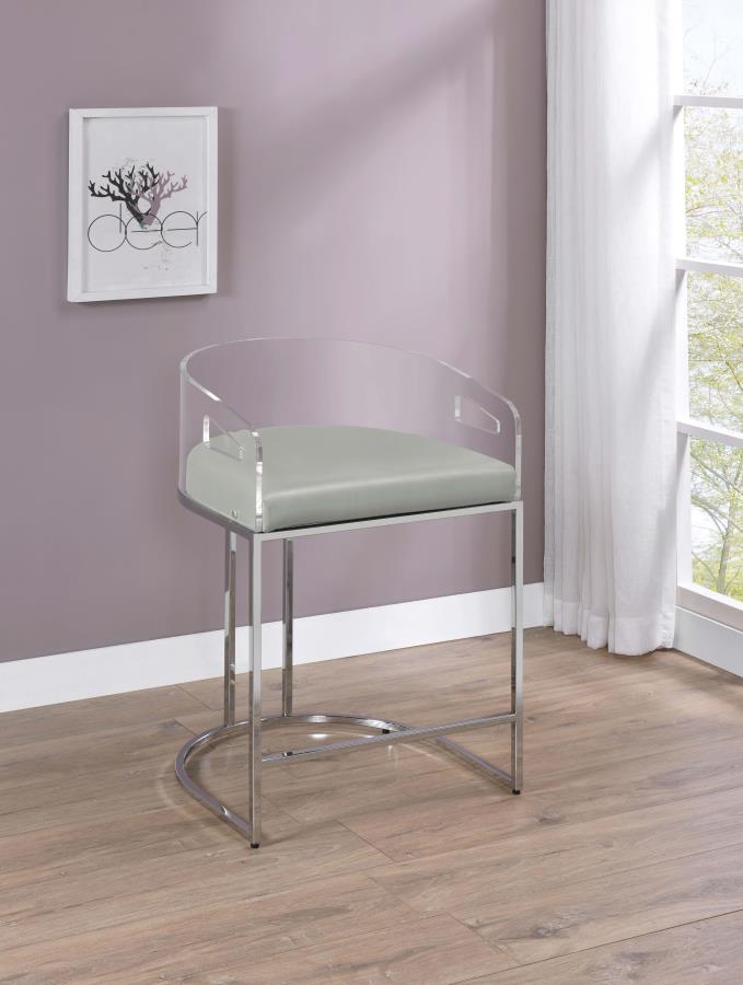 Ultra-modern with a retro-inspired vibe, this pair of stools make a striking piece to a dining room space. With a curved backrest in a clear acrylic material, each stool offers an open and airy design. Rest comfortably on a leatherette cushion as you dine