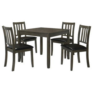  this contemporary five-piece dining set offers inviting style and a compact profile. The set centers on a square dining table crafted of wood with okume veneer in a stylish