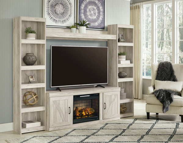 Express your modern farmhouse style with this entertainment center with fireplace. Its wispy white finish over replicated oak grain is a delightful change from the ordinary. The clean-lined, classic styling with barn door inspiration provides a country-ch