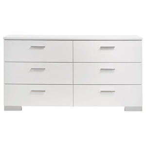  while chrome-finished metal handles and feet add refined contrast. Each drawer glides smoothly on metal 