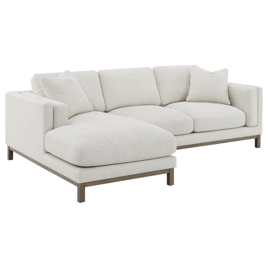 Indulge in the inviting comfort of this modern sectional sofa, thoughtfully designed with a left side chaise to accommodate your personal lounging preferences. Upholstered in a soft, textured bouclÃ© fabric, complemented with a solid wood pedestal base in
