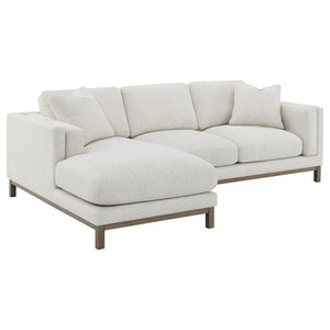 Indulge in the inviting comfort of this modern sectional sofa, thoughtfully designed with a left side chaise to accommodate your personal lounging preferences. Upholstered in a soft, textured bouclÃ© fabric, complemented with a solid wood pedestal base in
