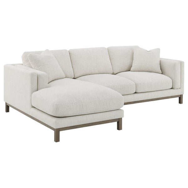 Indulge in the inviting comfort of this modern sectional sofa, thoughtfully designed with a left side chaise to accommodate your personal lounging preferences. Upholstered in a soft, textured bouclÃ© fabric, complemented with a solid wood pedestal base in
