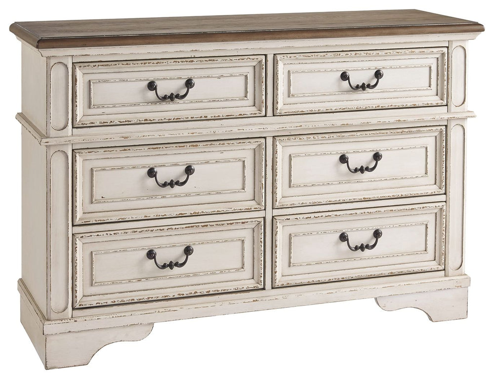 Elevating the art of traditional cottage styling, this dresser is your dream bedroom retreat realized. Its antiqued two-tone aesthetic blends a chipped white with a distressed wood finished top for added charm. Framed drawer fronts and decorative corbels 