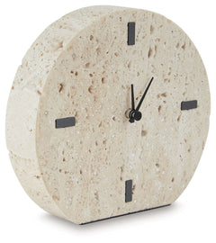 Take note of the time in contemporary style. Crafted from beige travertine, this clock is sure to lend minimalist flair to shelves and tabletops. Black accents provide a dramatic contrast to the earthy sensibility of the simple-yet-sophisticated timepiece