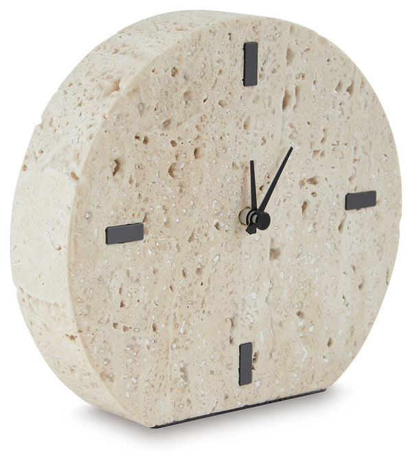 Take note of the time in contemporary style. Crafted from beige travertine, this clock is sure to lend minimalist flair to shelves and tabletops. Black accents provide a dramatic contrast to the earthy sensibility of the simple-yet-sophisticated timepiece