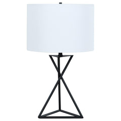 Enhance your sanctuary with this elegant bedside table lamp, a beacon of ambient lighting that radiates modern charm. Its drum shade casts a soft, inviting glow, perfect for unwinding in your personal retreat. The geometric base adds a touch of contempora