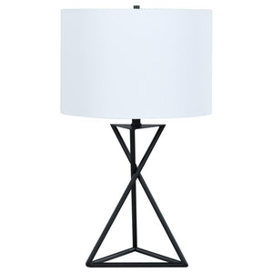 Enhance your sanctuary with this elegant bedside table lamp, a beacon of ambient lighting that radiates modern charm. Its drum shade casts a soft, inviting glow, perfect for unwinding in your personal retreat. The geometric base adds a touch of contempora