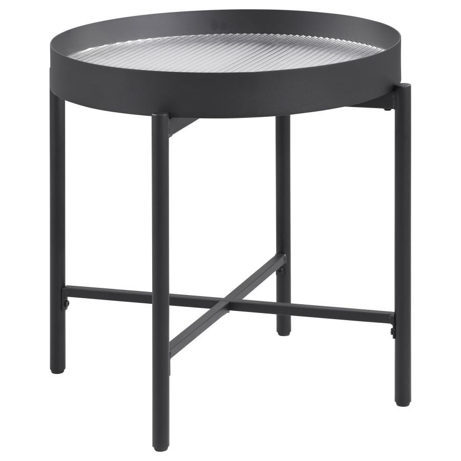 This elegant accent table invites modern style into your living room. With a sleek metal frame in a sandy black powder coated finish and a tempered reeded glass top, it effortlessly transforms into an occasional table or utility table. Whether placed besi
