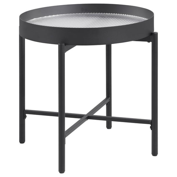 This elegant accent table invites modern style into your living room. With a sleek metal frame in a sandy black powder coated finish and a tempered reeded glass top, it effortlessly transforms into an occasional table or utility table. Whether placed besi