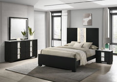 This bedroom set epitomizes modern luxury with its bold, black finish and striking contrast detailing. The bedâ€™s commanding headboard features a chic marble-like accent and integrated lighting, creating an opulent focal point in the room. Complementary 
