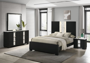 This bedroom set epitomizes modern luxury with its bold, black finish and striking contrast detailing. The bedâ€™s commanding headboard features a chic marble-like accent and integrated lighting, creating an opulent focal point in the room. Complementary 