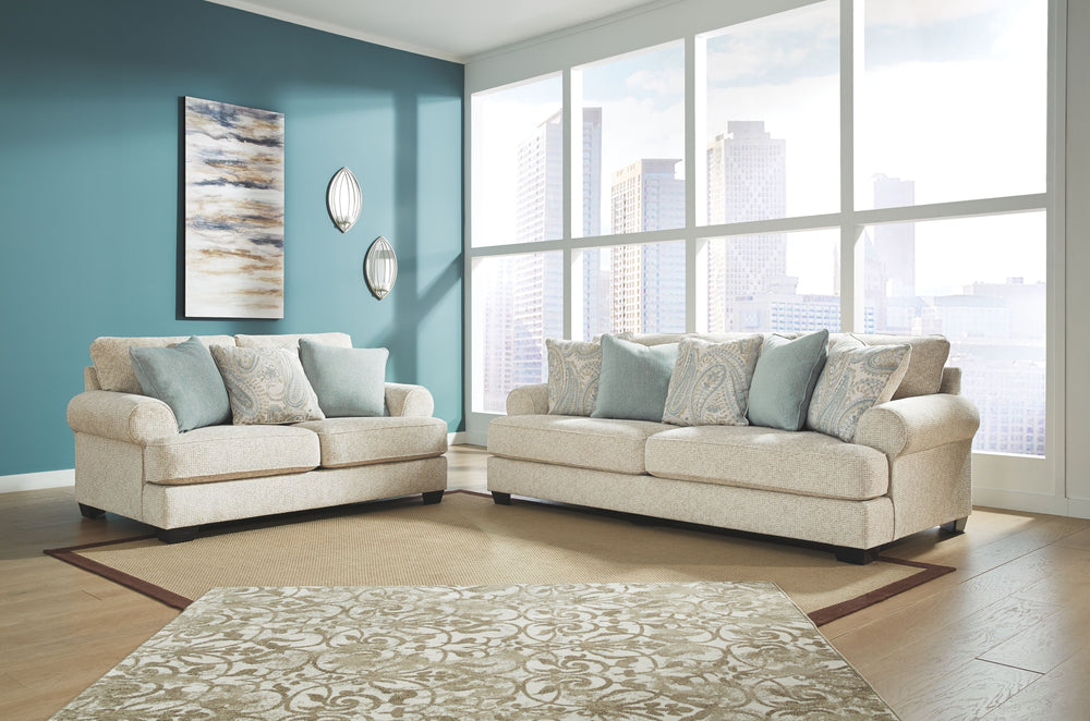 Everyone can have the best seat in the house with this sofa and loveseat. An indulgent choice with deep seats crafted for cloud-like softness, this set is the ideal merger of modern flair and classic staying power. <h4><b>Monaghan - Sandstone - Sofa</b></