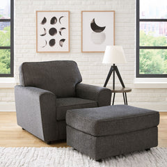 Revamp your sleekly styled living room sanctuary with this chair and ottoman. Well-suited to contemporary spaces with a calming neutral upholstery in slate gray, it makes a subtle design statement in your space whether youâ€™re hosting guests or enjoying 