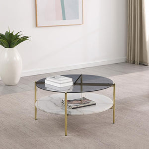  this modern coffee table creates a glamorous aura with its sleek glass and white marble elements. The round smoked tempered glass top rests upon a gleaming white marble shelf