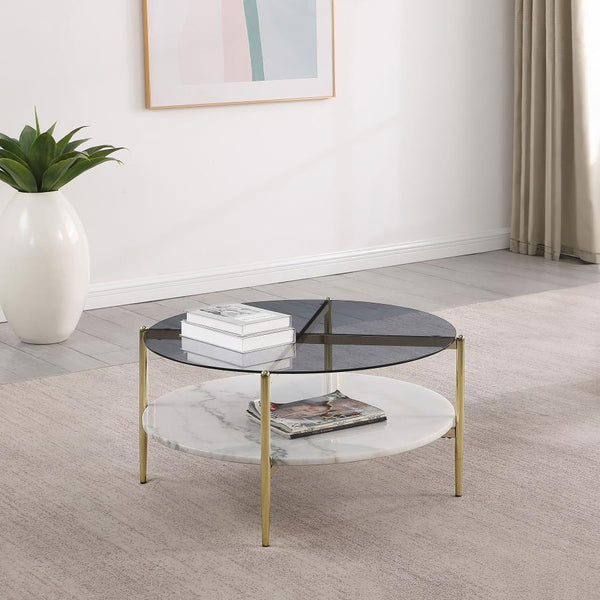  this modern coffee table creates a glamorous aura with its sleek glass and white marble elements. The round smoked tempered glass top rests upon a gleaming white marble shelf