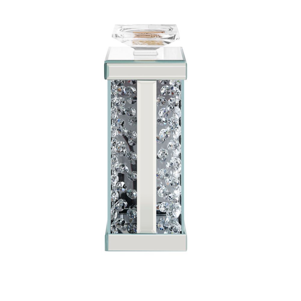 Nothing says ambiance quite like a flickering flame! Put your favorite scented candles or flameless designs on display with this classic Nysa candleholder. A versatile addition to your abode, it can be used in any room and features a mirrored frame with f