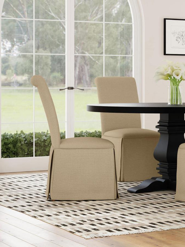  somewhat formal spin on your dining room decor with a set of two classic parson chairs. Each features a tall back with an armless profile for impeccable comfort and elegance. The chair features plush foam padding