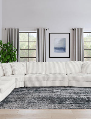  upholstered in ivory wide corduroy. This piece offers plush comfort and easily fits anywhere within your modular setup.