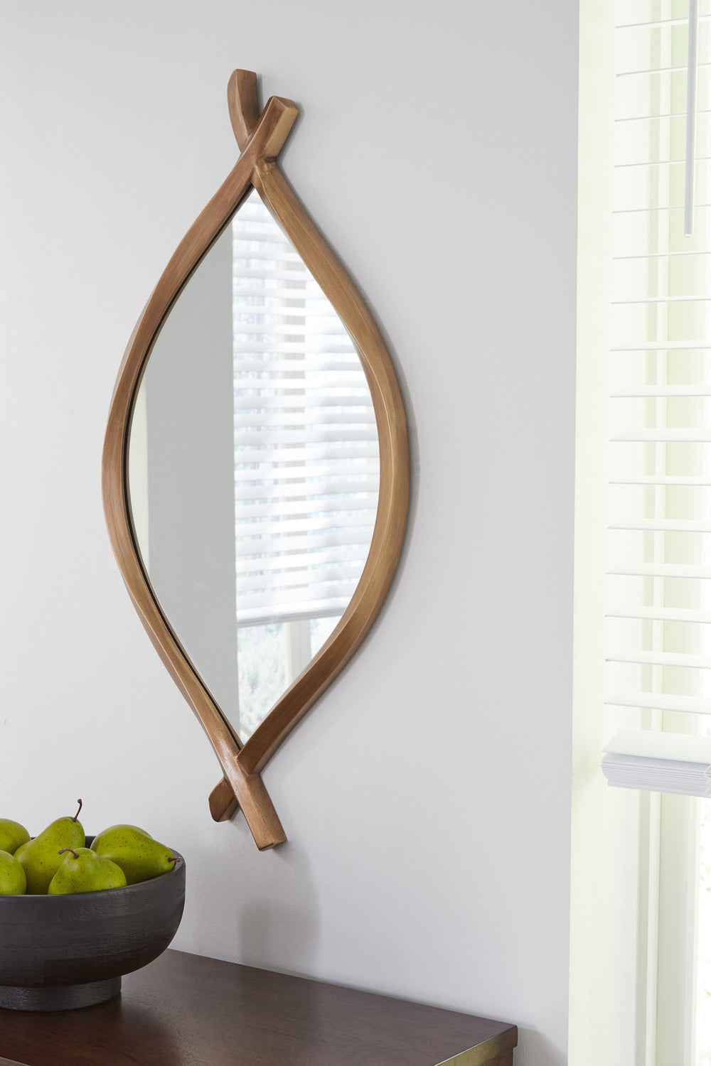 Simple twisted metal gives this mirror a distinct artisanal look. Its organic lines are completed with a classic antiqued goldtone finish. What a naturally beautiful touch, especially for an entryway.<br><br><b>Additional Dimensions</b><br><ul><li>Inner m