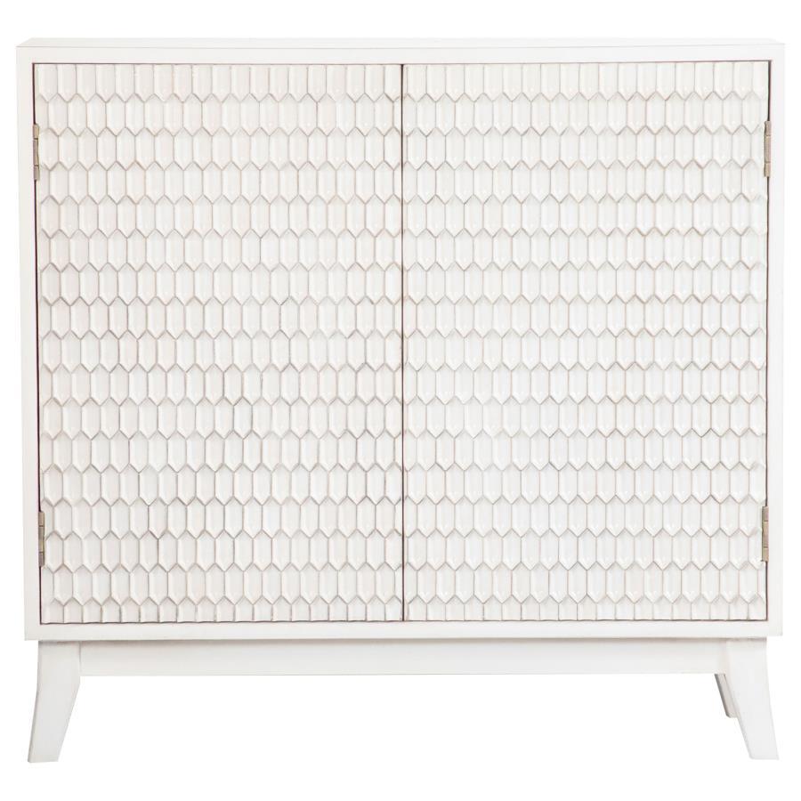 This two-door cabinet adds subtle charm with its crisp white finish and sculpted geometric door fronts. The raised honeycomb-inspired texture brings dimension and interest to the faÃ§ade, while lightly distressed edging offers a softly weathered touch. In