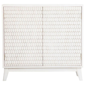 This two-door cabinet adds subtle charm with its crisp white finish and sculpted geometric door fronts. The raised honeycomb-inspired texture brings dimension and interest to the faÃ§ade, while lightly distressed edging offers a softly weathered touch. In