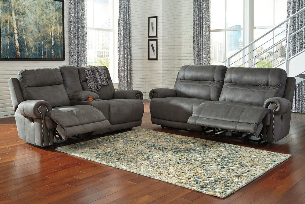 Take a rest with this living room set. Subtle touches such as sporty jumbo stitching, nailhead trim and a -"weather worn-" effect on the upholstery give this handsome set a buttoned-up appeal and fresh feel. Loveseat has center console with dual cup holde