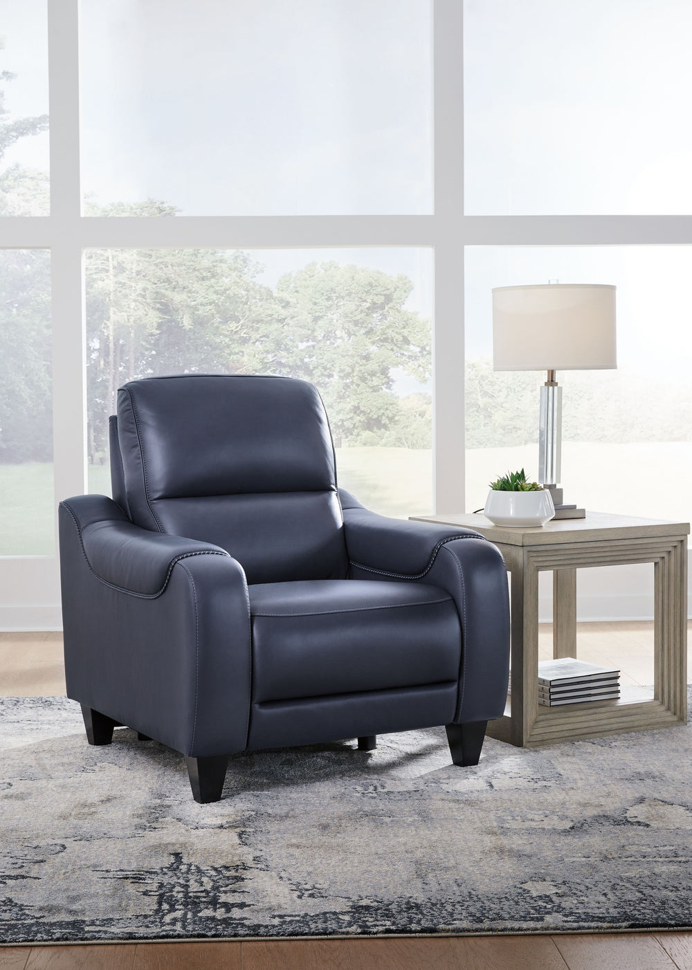 This power recliner puts a sleek twist on laid-back living. It satisfies your desire for comfort without being bulky in design, thanks to subtly incorporated one-touch reclining and adjustable headrests. With chic exposed legs and stunning stitching detai