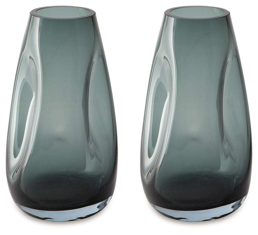 Sleek. Contemporary. Chic. This vase has an organic sense of movement, recalling seaside aesthetics with its teal glass. A stunning solo accent, it also acts as a beautiful vessel for florals and other decorative fillers. And the vase is safe for outdoor 