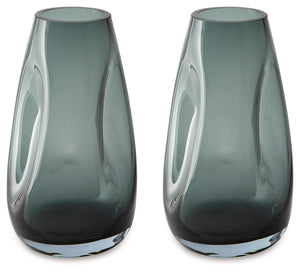 Sleek. Contemporary. Chic. This vase has an organic sense of movement, recalling seaside aesthetics with its teal glass. A stunning solo accent, it also acts as a beautiful vessel for florals and other decorative fillers. And the vase is safe for outdoor 