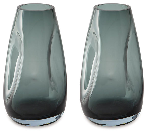 Sleek. Contemporary. Chic. This vase has an organic sense of movement, recalling seaside aesthetics with its teal glass. A stunning solo accent, it also acts as a beautiful vessel for florals and other decorative fillers. And the vase is safe for outdoor 