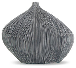 Sculptural in form, simply stunning in function. This vase captures the eye with its asymmetrical, curved shape. Itâ€™s an ideal accessory for your curated approach to casual design.<br/><br/><b>Product Features</b><ul><li>Made with polyresin</li><li>Anti