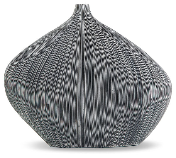 Sculptural in form, simply stunning in function. This vase captures the eye with its asymmetrical, curved shape. Itâ€™s an ideal accessory for your curated approach to casual design.<br/><br/><b>Product Features</b><ul><li>Made with polyresin</li><li>Anti