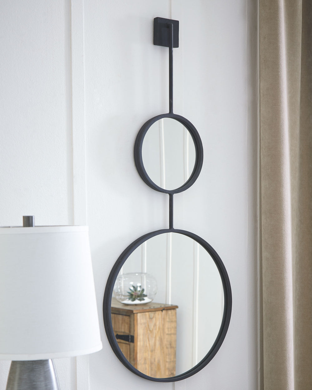 Contemporary style is stacking up beautifully in this metal framed accent mirror with stacked circle design. Whether gracing an entryway or brightening up a hallway or vanity area, what a simply striking way to round out a room.<br><br><b>Additional Dimen