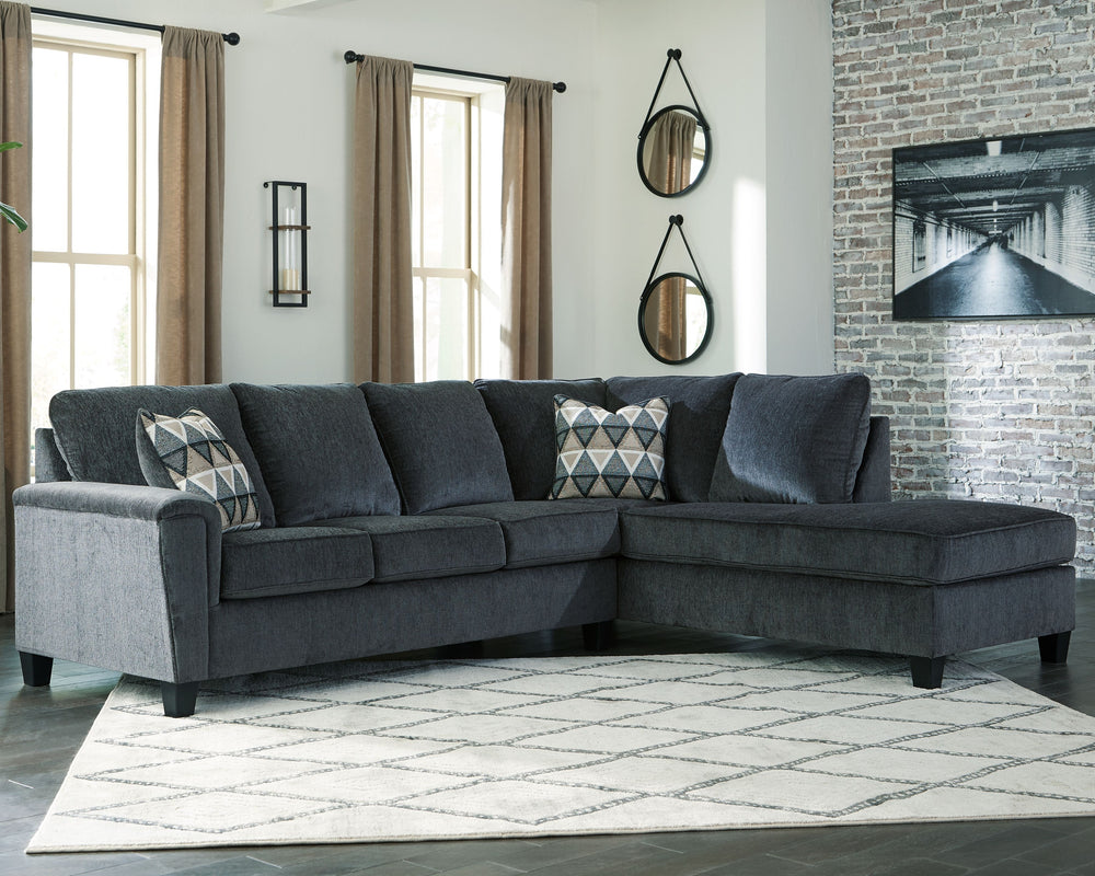 If youâ€™re looking for a smokin-' hot look priced to entice, youâ€™re sure to find this budget-conscious sectional beautifully fits the bill. Covered in a smoke gray chenille upholstery loaded with plush texture, this less-is-more contemporary sectional 