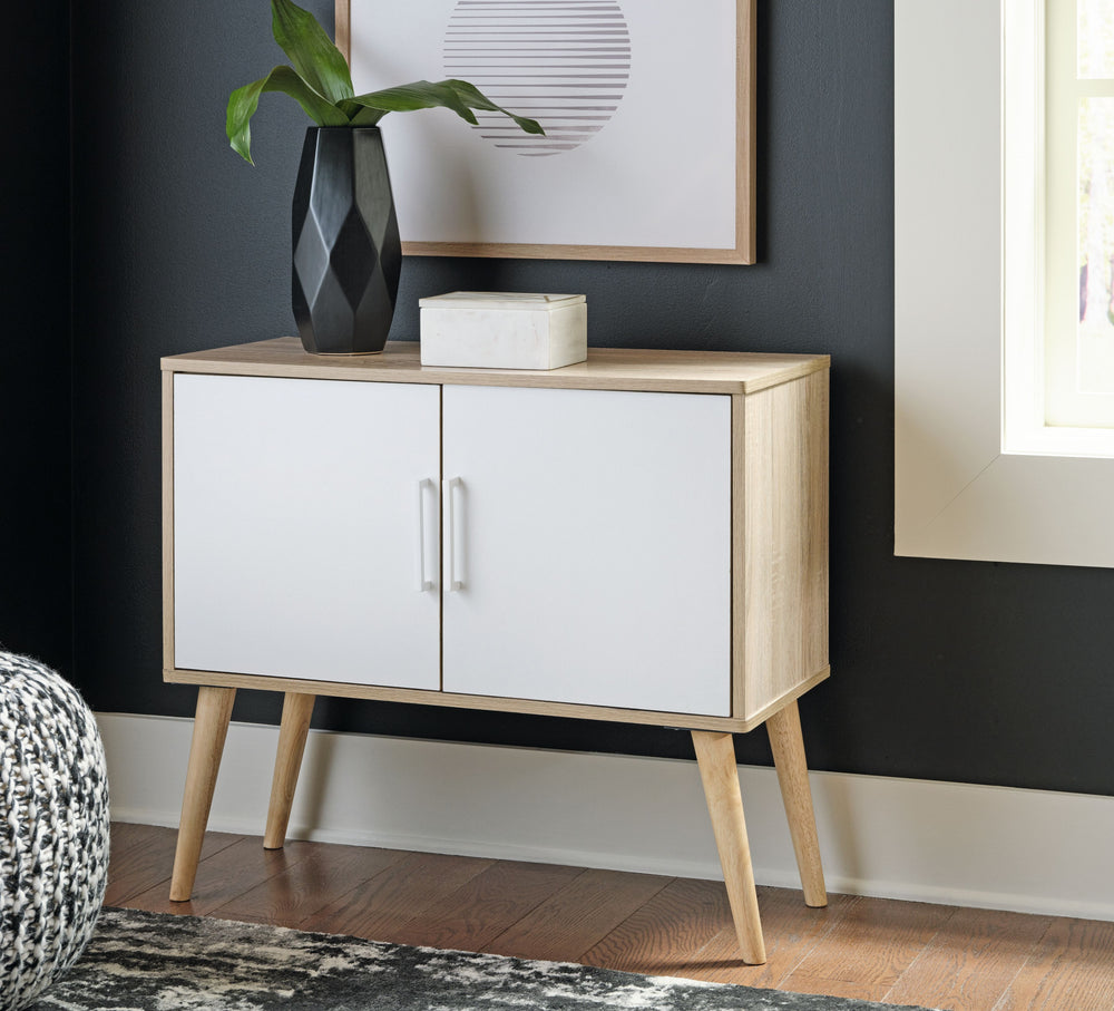 Open the door to clean-lined form and functionality with this accent cabinet. Its homey natural finish is enhanced with crisp white doors and pulls. Adjustable shelf caters to your needs.<br><br><b>Additional Dimensions</b><br><ul><li>Door opening: 0-"</l
