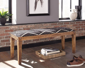  blending natural wood tones with bohemian-inspired upholstery. The solid mango wood frame showcases a rich