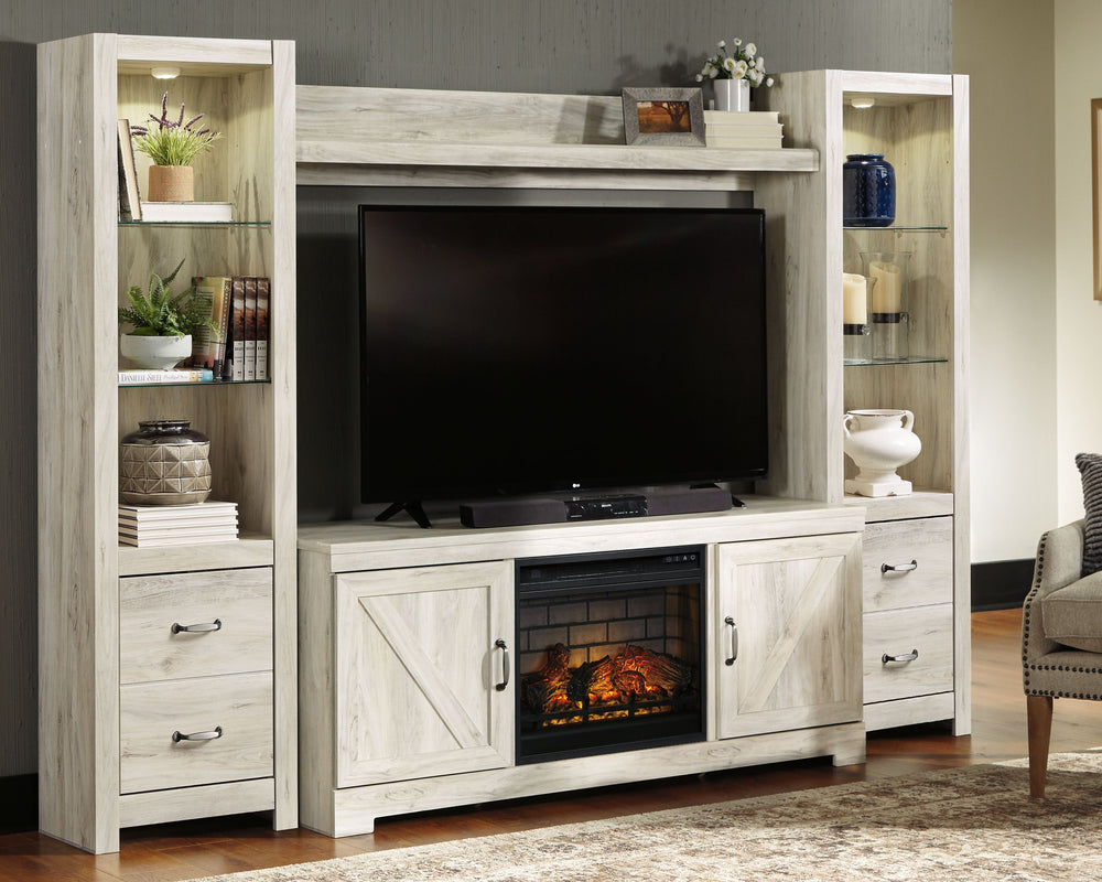 Express your farmhouse style with this entertainment center. Its wispy white finish over replicated oak wood grain is a delightful change from the ordinary. Clean-lined, classic styling with barn door inspiration provides a country chic aesthetic thatâ€™s