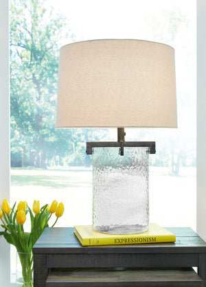  this unique table lamp is designed to highlight its quality materials. Crafted with clear