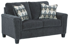 If youâ€™re looking for a smokinâ€™ hot look priced to entice, youâ€™re sure to find this space-conscious, budget-conscious loveseat beautifully fits the bill. Covered in a smoke gray chenille upholstery loaded with plush texture, this less-is-more contem