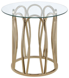 This round end table features a clear tempered glass top set atop a durable metal frame. The base is finished in electroplated chocolate chrome, offering a rich, deeper brass tone. The stylish geometric design creates an elegant look, while the tempered g