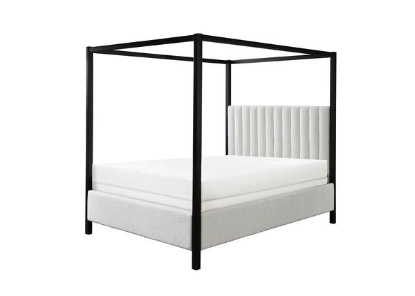 This canopy bed is a modern statement piece, blending the luxurious feel of a traditional four-poster bed with the clean, sleek lines of contemporary design. Its bold, black frame creates a striking silhouette against any bedroom backdrop, while the plush